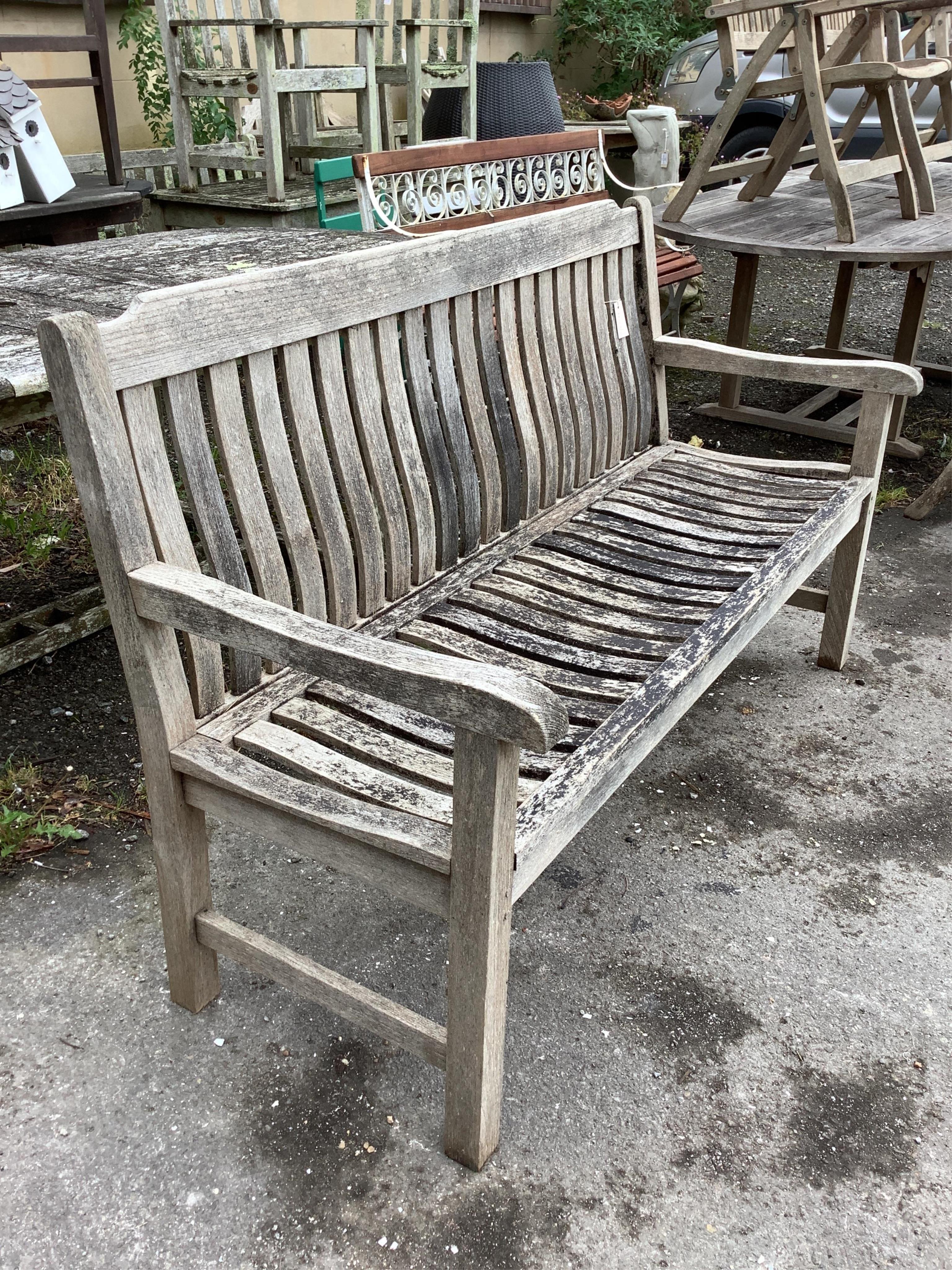 A weathered teak slatted garden bench by Neptune,width 154cm, depth 58cm, height 92cm